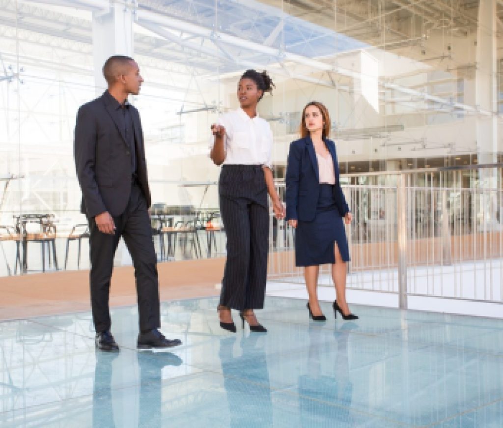 Real estate agent showing office building inside