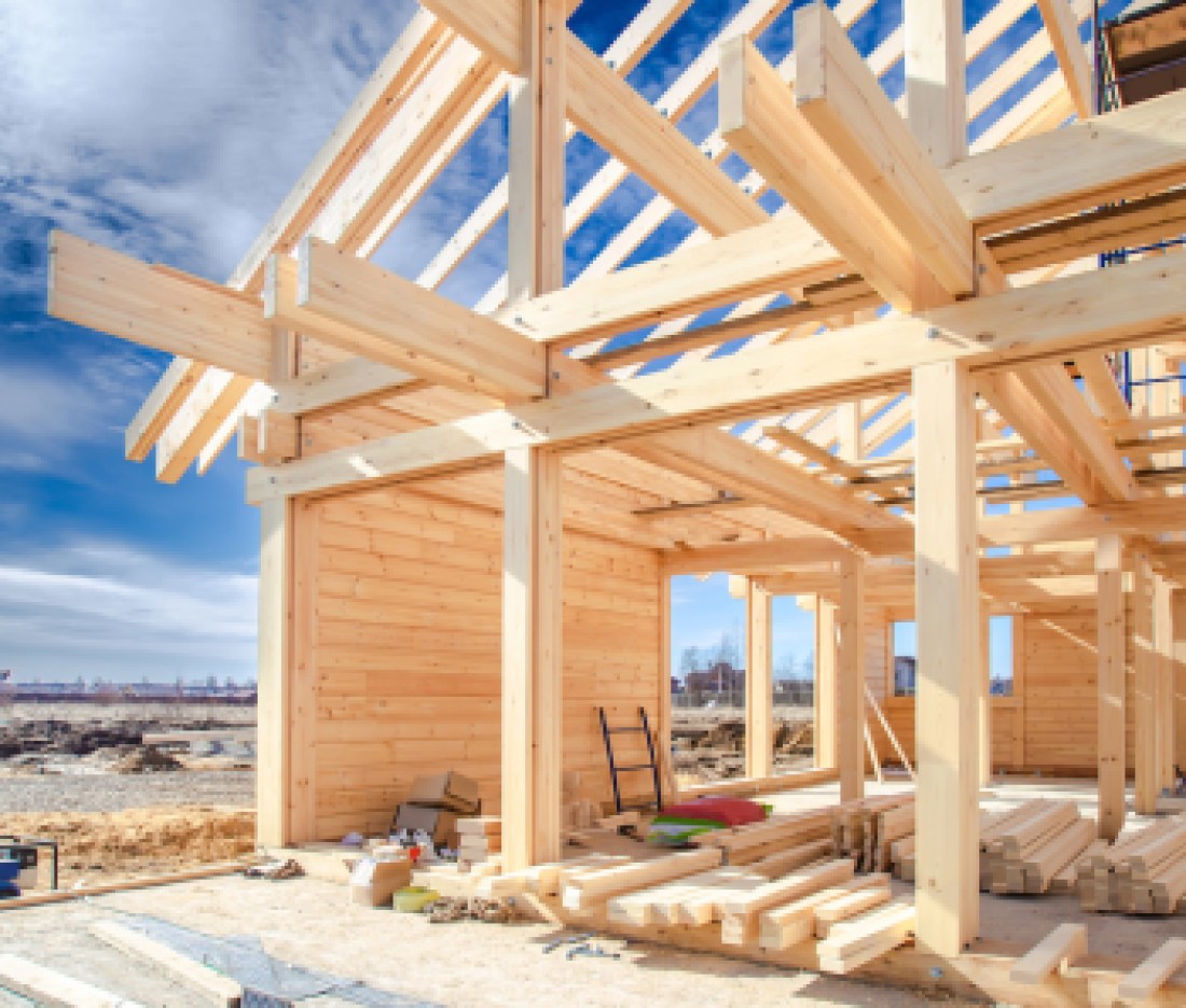 Built a cottage on the site. Construction site. Wooden frame of the home from a bar. The house wooden foundation. Building of houses under the key. Production of wooden houses.
